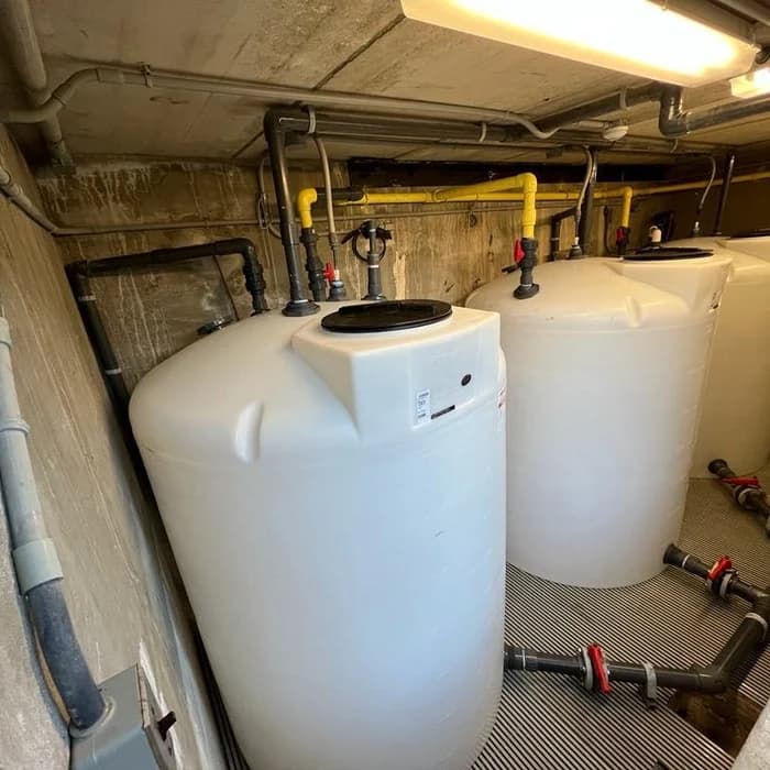 Pool equipment room with chemical feed tanks and plumbing